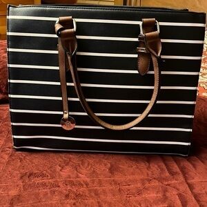 Call it spring bag color black and white and brown nice handbag good condition